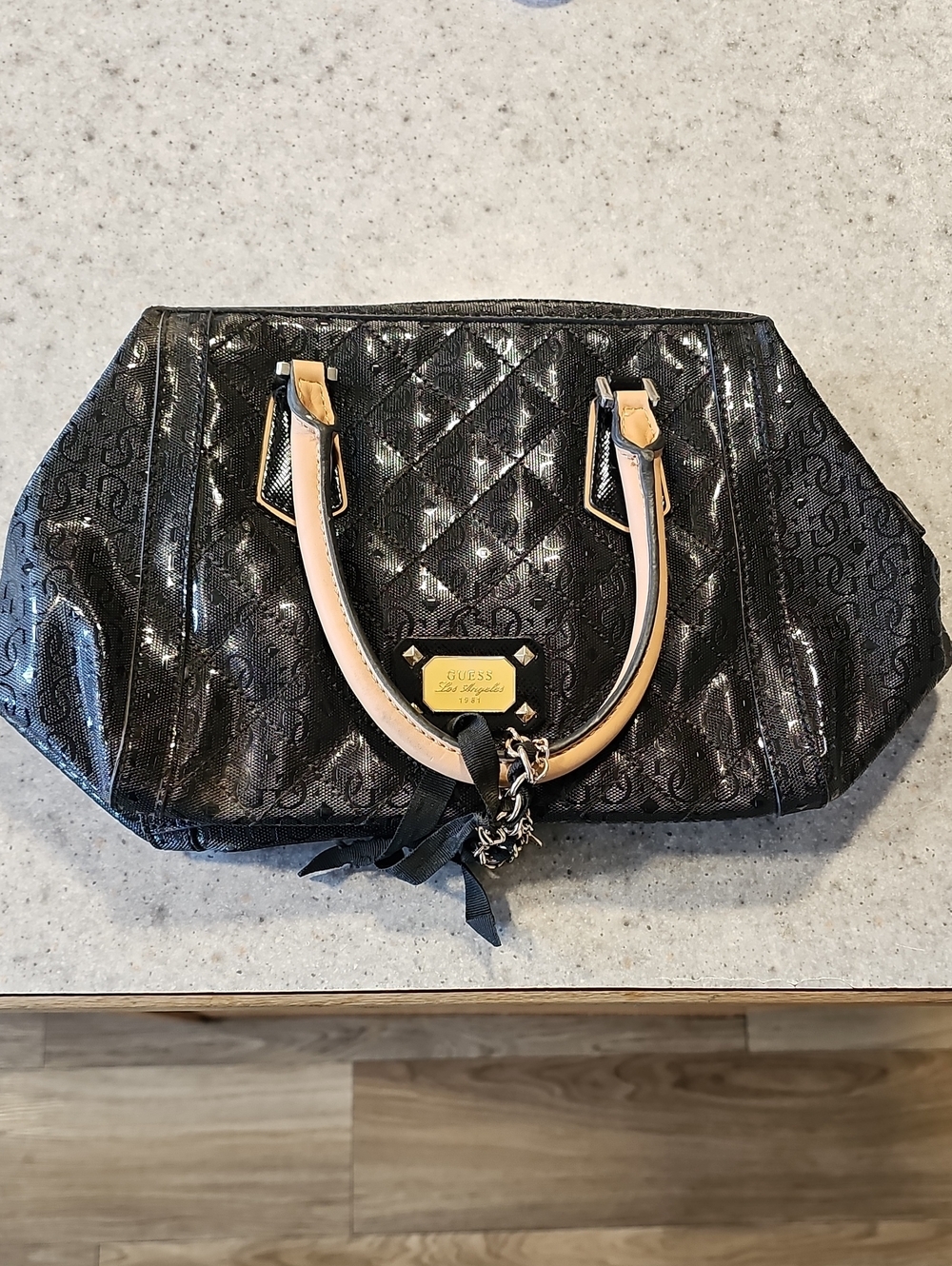 GUESS Black Satchel with Tan Handles and Gold Plaque